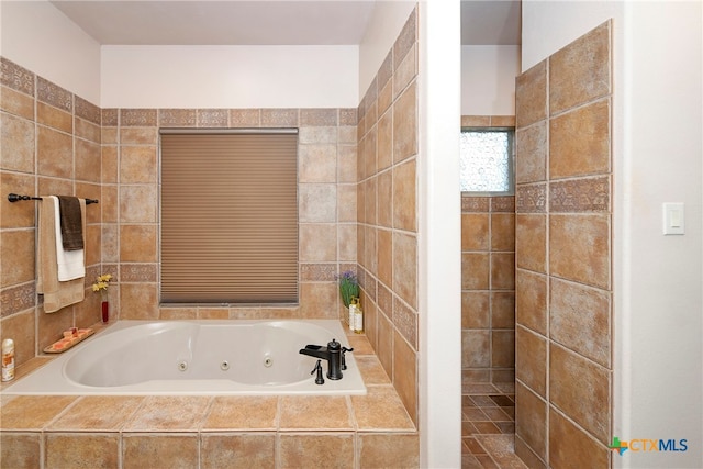 bathroom featuring tiled bath