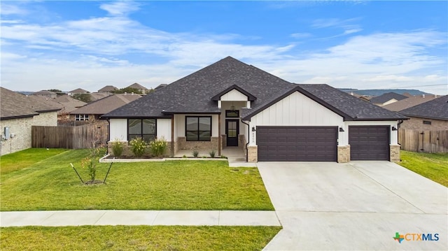 view of front facade featuring a garage and a front yard