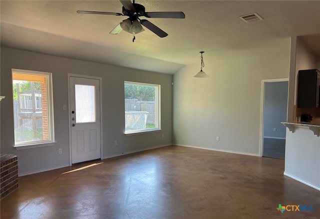 entryway featuring finished concrete flooring, ceiling fan, baseboards, and visible vents