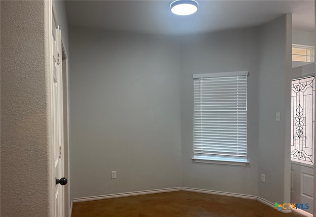 carpeted entrance foyer with baseboards