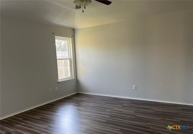 unfurnished room featuring baseboards, a ceiling fan, and dark wood-style floors