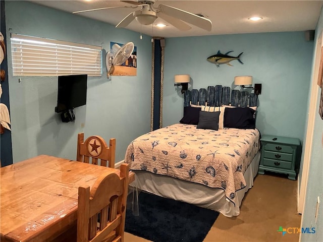 carpeted bedroom with ceiling fan