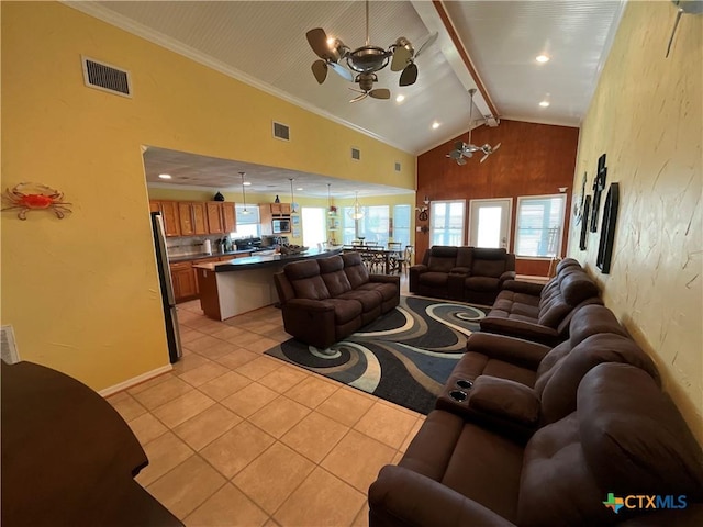 living room featuring beam ceiling, high vaulted ceiling, a healthy amount of sunlight, and light tile patterned flooring