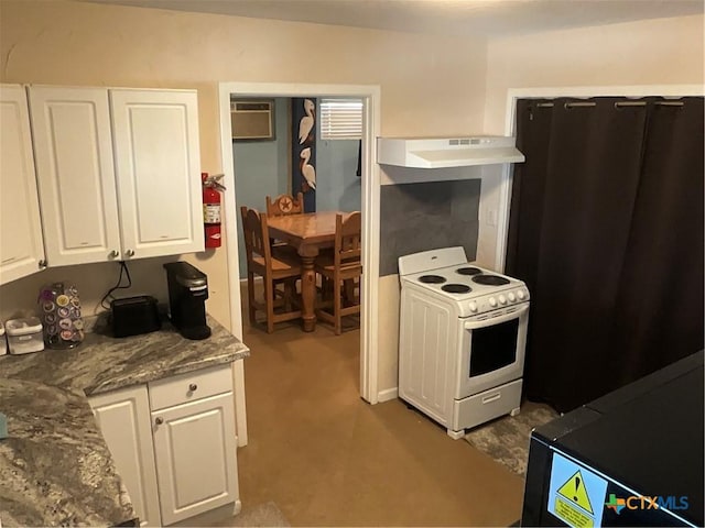 kitchen with white cabinetry, a wall unit AC, stone counters, and white electric range oven