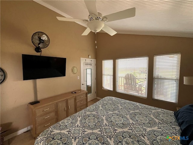 bedroom with crown molding, ceiling fan, and lofted ceiling