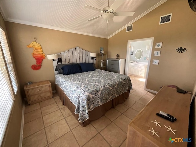 bedroom featuring ceiling fan, ornamental molding, vaulted ceiling, and light tile patterned floors