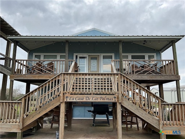 back of property with a patio