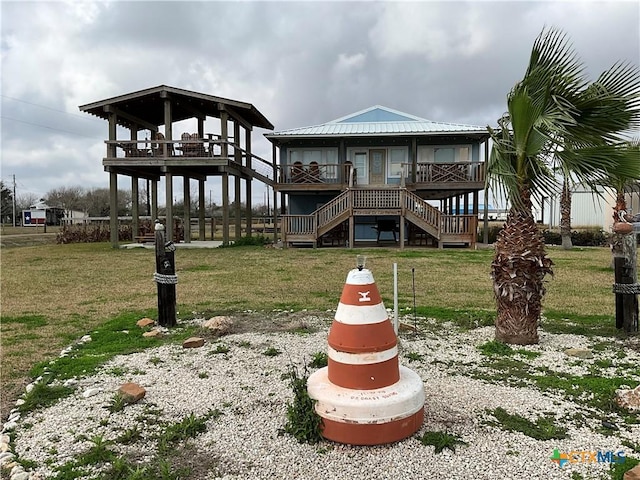 rear view of property with a lawn