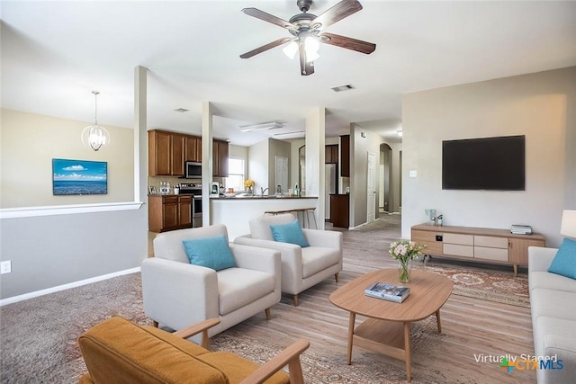 823 Kachina Loop, Harker Heights, TX 76548 - living area with ceiling fan, baseboards, and arched walkways