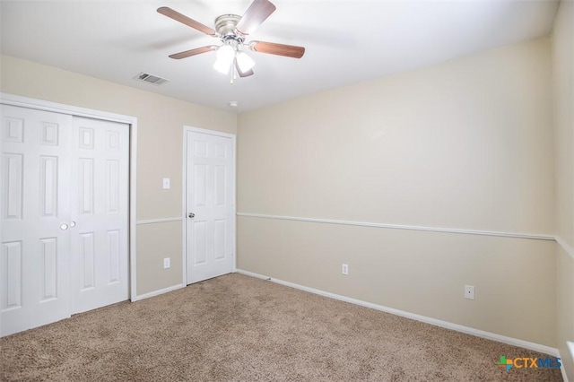 823 Kachina Loop, Harker Heights, TX 76548 - unfurnished bedroom with carpet floors, baseboards, a closet, and a ceiling fan