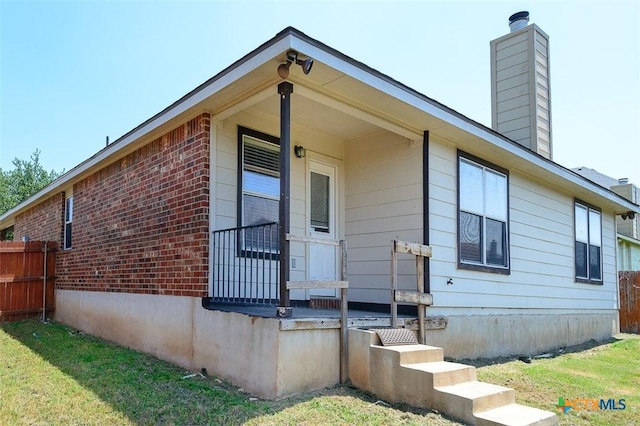 823 Kachina Loop, Harker Heights, TX 76548 - view of home's exterior featuring a chimney and brick siding