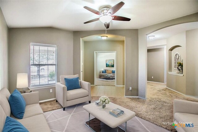 823 Kachina Loop, Harker Heights, TX 76548 - carpeted living room with arched walkways, a ceiling fan, and baseboards