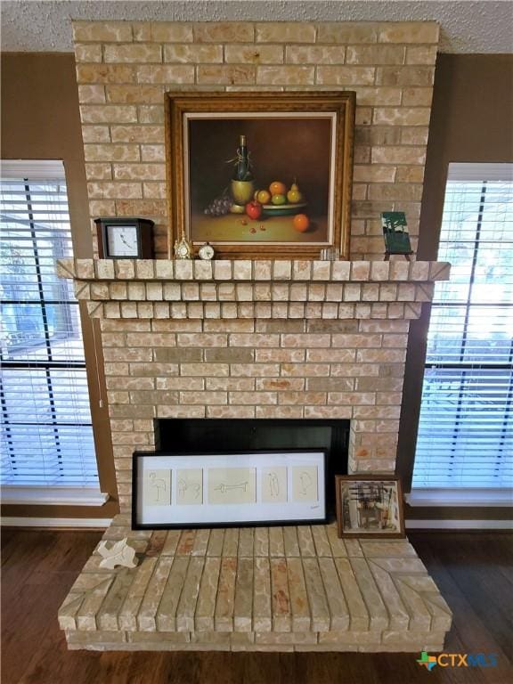 interior details featuring hardwood / wood-style floors and a textured ceiling