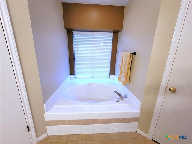 bathroom with tiled bath