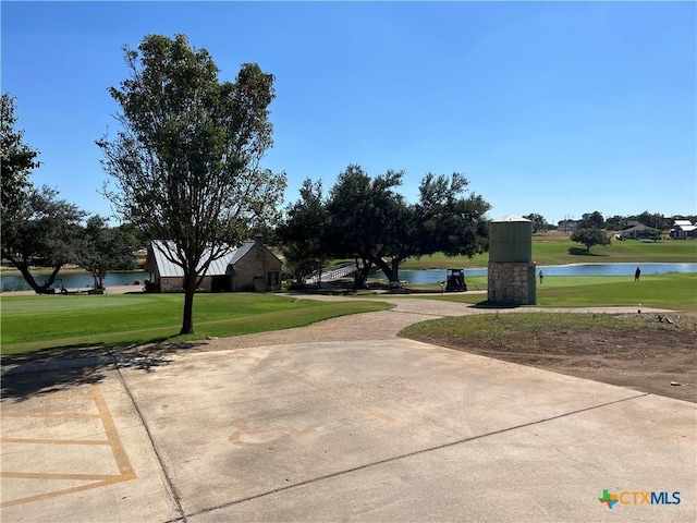 exterior space with a yard and a water view