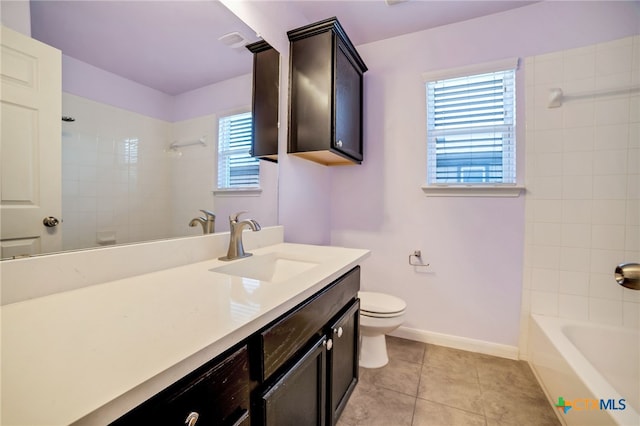 full bathroom featuring toilet, vanity, tile patterned floors, and tiled shower / bath