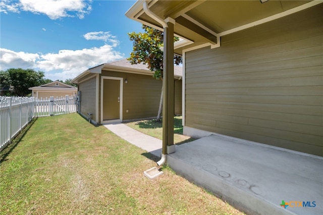 view of yard with a storage shed and a patio