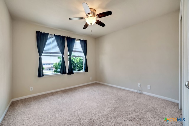 carpeted empty room with ceiling fan