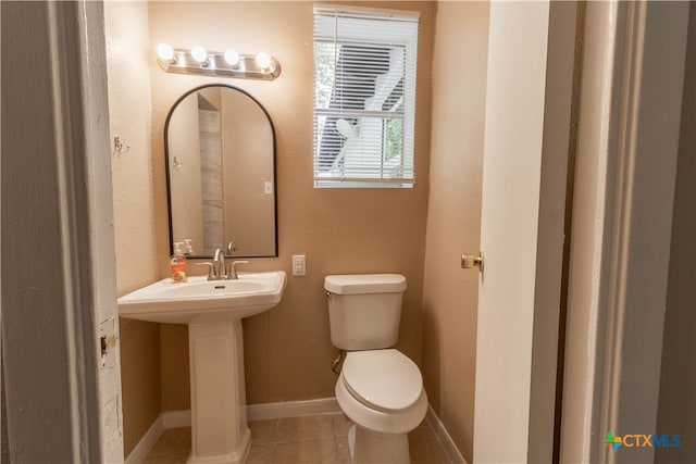 bathroom featuring tile patterned floors, sink, and toilet