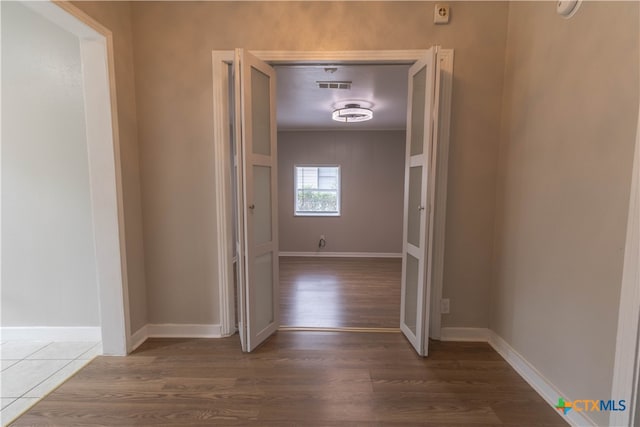 hall featuring dark wood-type flooring