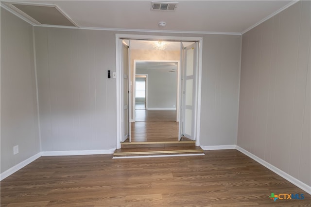 hallway with crown molding and dark wood-type flooring