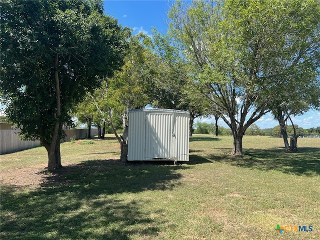 view of outdoor structure featuring a lawn