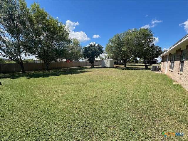 view of yard with central air condition unit