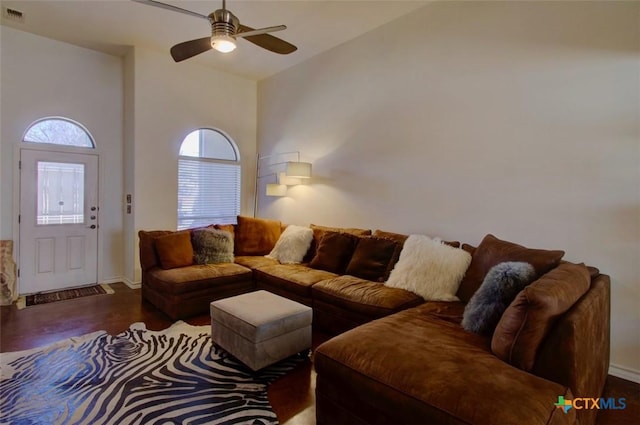 living area featuring ceiling fan, wood finished floors, and visible vents