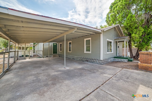 exterior space with a carport