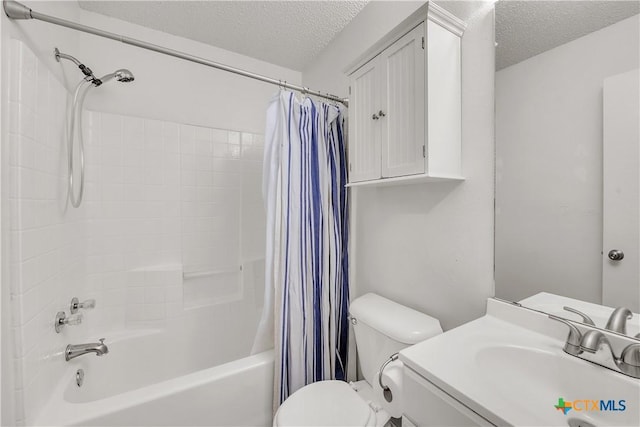 full bathroom with a textured ceiling, toilet, shower / bath combination with curtain, and vanity