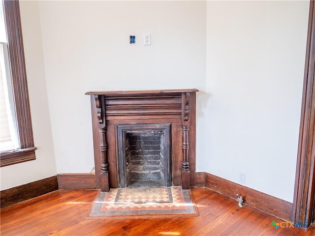 details with baseboards and wood finished floors