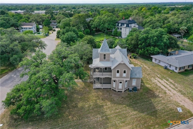 drone / aerial view featuring a view of trees