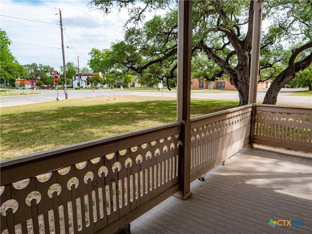 wooden terrace with a yard