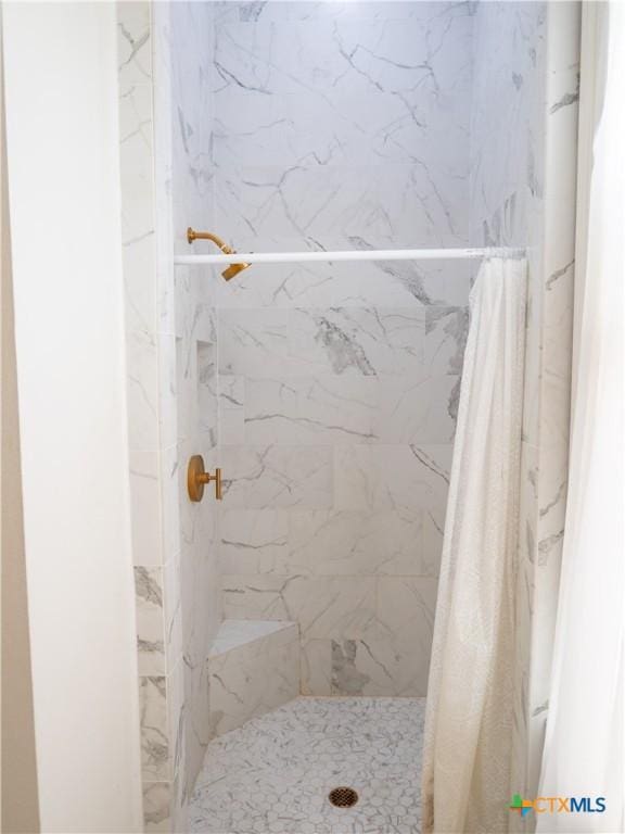 full bathroom with a shower stall