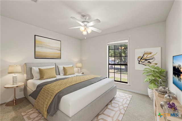 carpeted bedroom featuring ceiling fan