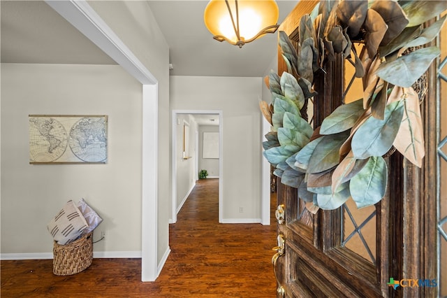 corridor featuring dark hardwood / wood-style flooring