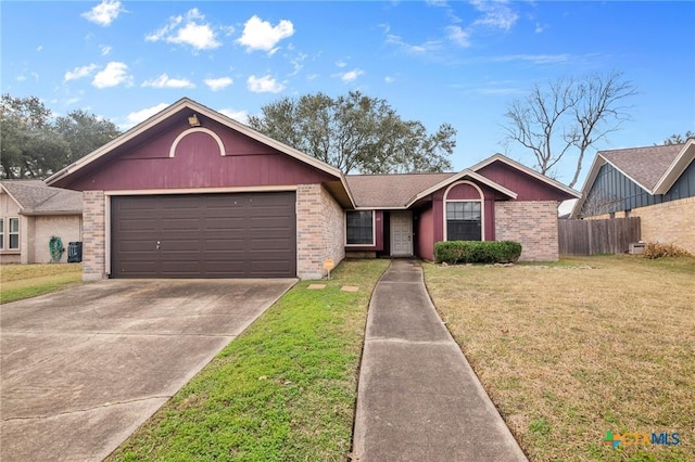 ranch-style home featuring a garage, central AC, and a front lawn