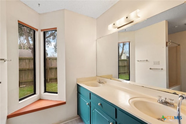 bathroom featuring vanity and a textured ceiling