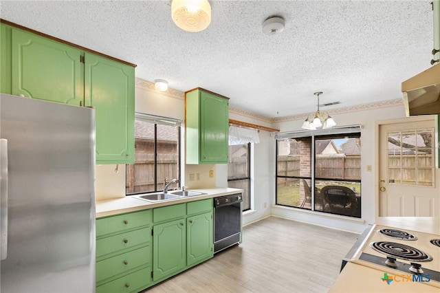 kitchen with pendant lighting, sink, stainless steel refrigerator, dishwasher, and light wood-type flooring