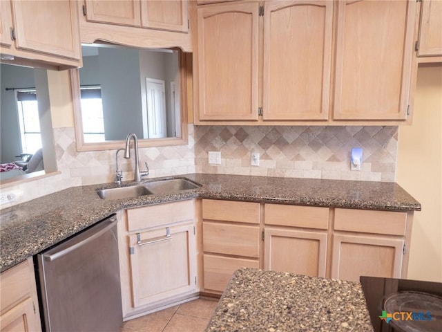 kitchen with dishwasher, tasteful backsplash, light brown cabinetry, and a sink