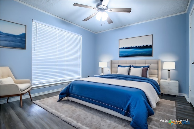 bedroom with dark hardwood / wood-style flooring, ornamental molding, and ceiling fan