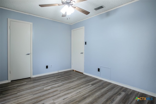 spare room with hardwood / wood-style flooring, ceiling fan, a textured ceiling, and ornamental molding