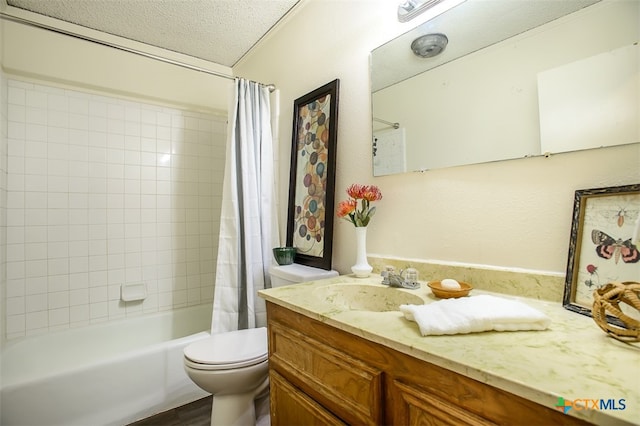 full bathroom featuring toilet, shower / tub combo, vanity, and a textured ceiling