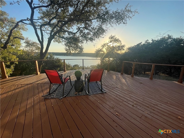 deck at dusk with a water view