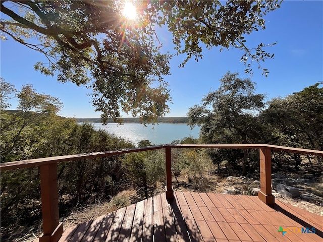 wooden deck with a water view