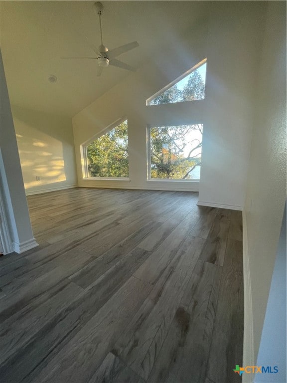 additional living space with hardwood / wood-style floors, ceiling fan, and vaulted ceiling