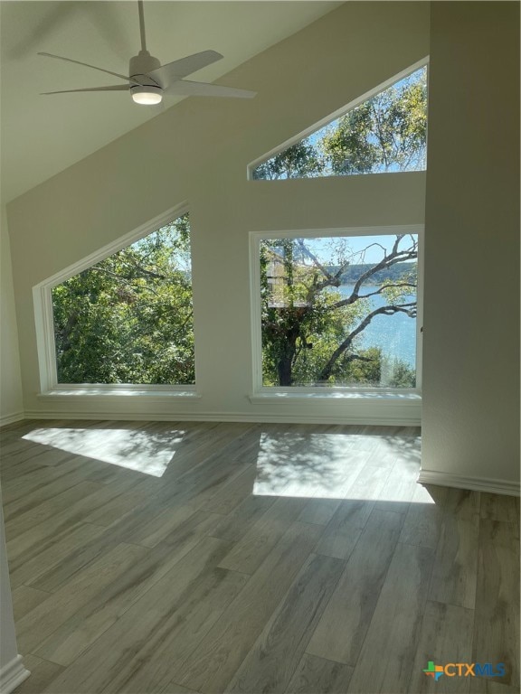 bonus room featuring hardwood / wood-style floors, ceiling fan, and lofted ceiling