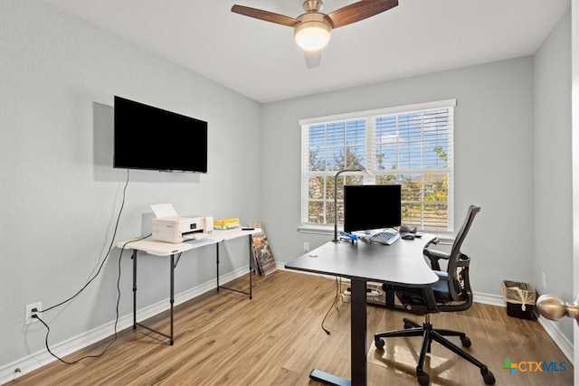 office with hardwood / wood-style flooring and ceiling fan