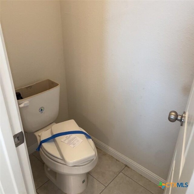 3805 Flat Rock Mountain Dr, Killeen, TX 76549 - bathroom with toilet, baseboards, and tile patterned flooring