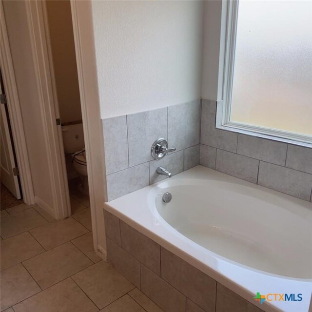 3805 Flat Rock Mountain Dr, Killeen, TX 76549 - bathroom with tile patterned floors, a garden tub, and toilet